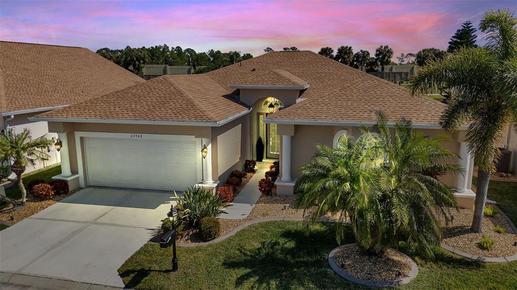 a front view of a house with a yard