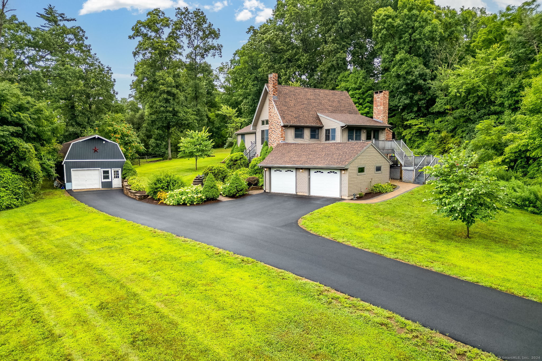 an aerial view of a house with swimming pool