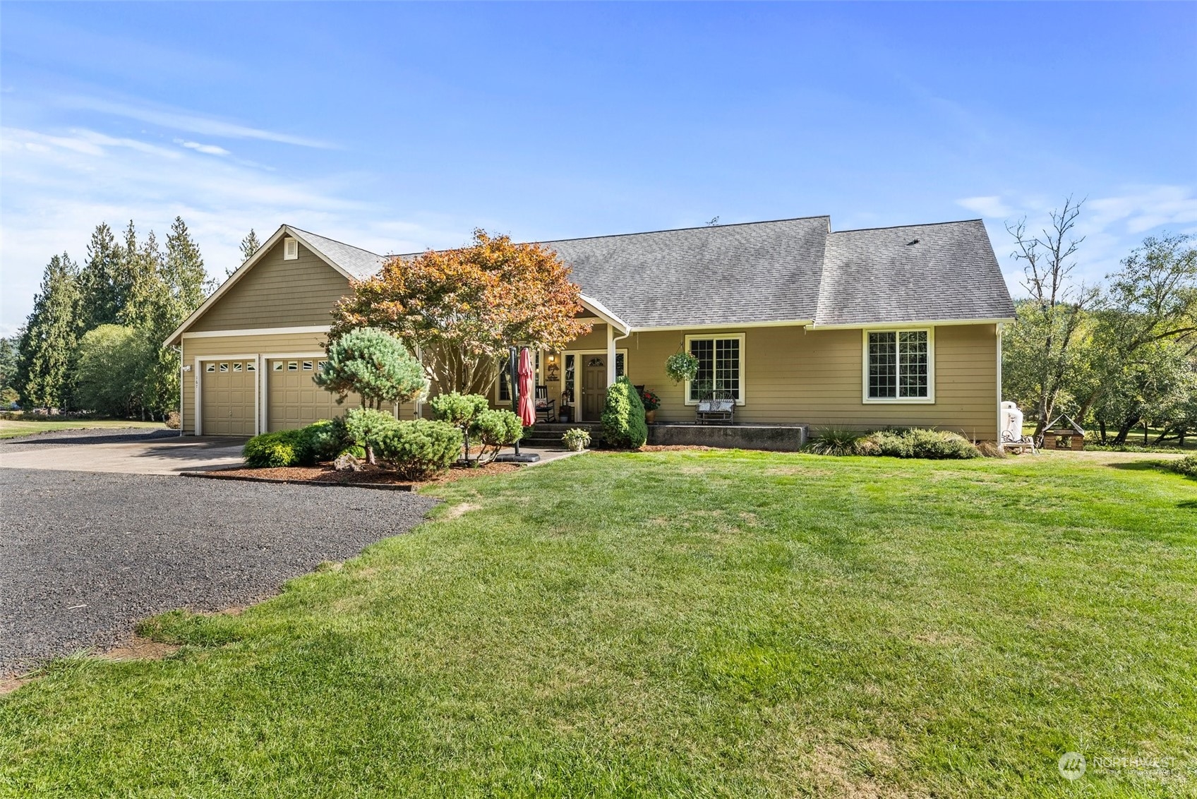 a front view of a house with a garden