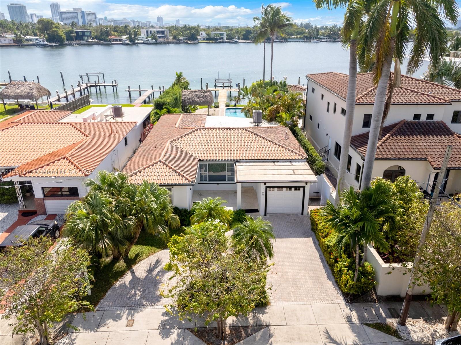 an aerial view of a house with outdoor space and lake view