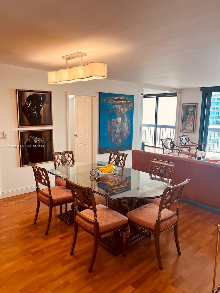 a view of a dining room with furniture and window