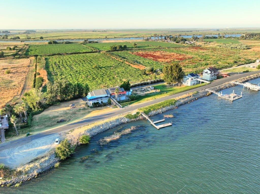 Come home to living on Delta.  521 W. Brannan Island Road, with its distinctive blue awning,  is locally known as one of the "TALL" houses on the island.  This property has water frontage that can accommodate a dock.