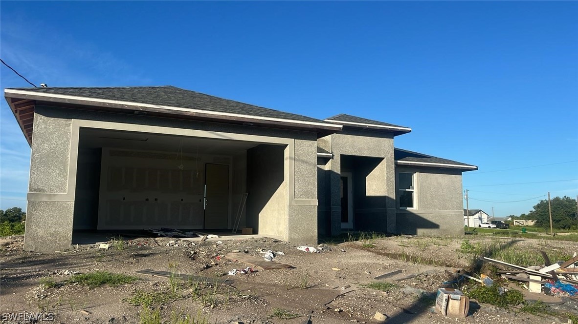 a front view of a house with a garage