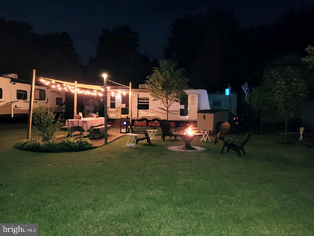 a view of a backyard with swimming pool