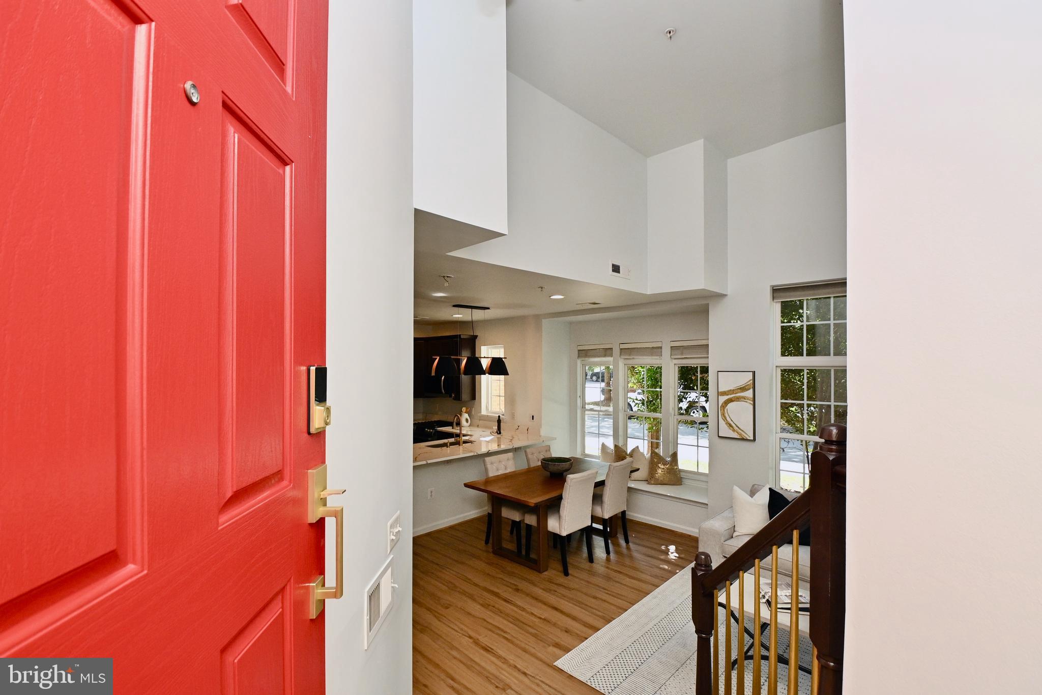 a view of a dining room with furniture and window