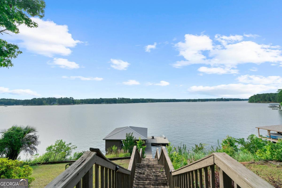 a view of a balcony with lake view and mountain view