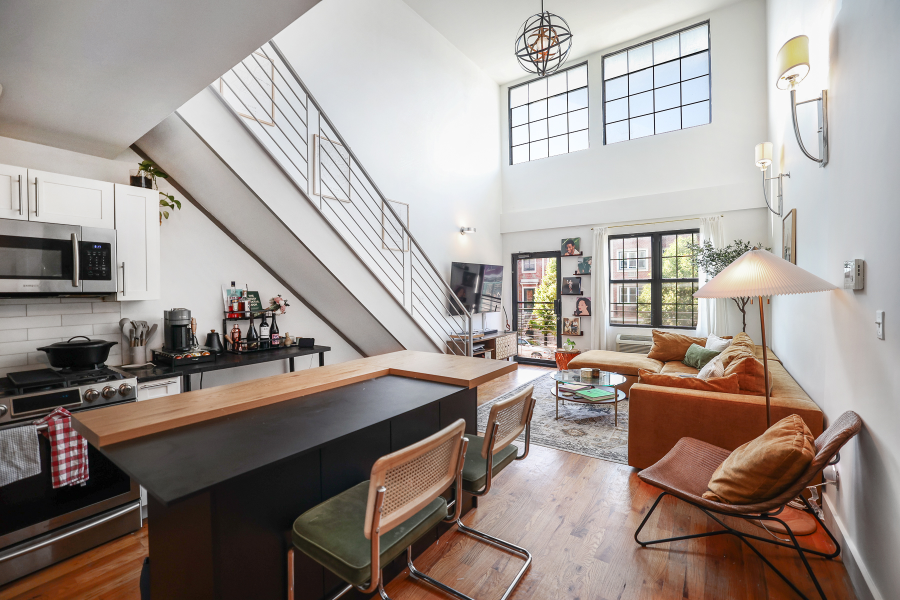 a dining room with wooden floor and furniture