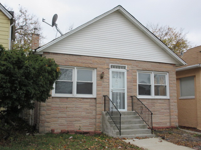 a front view of a house with a garage