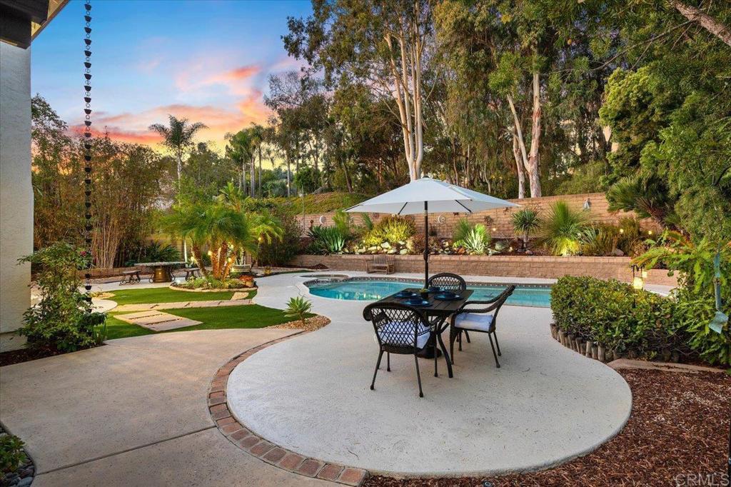 a view of a swimming pool with a patio