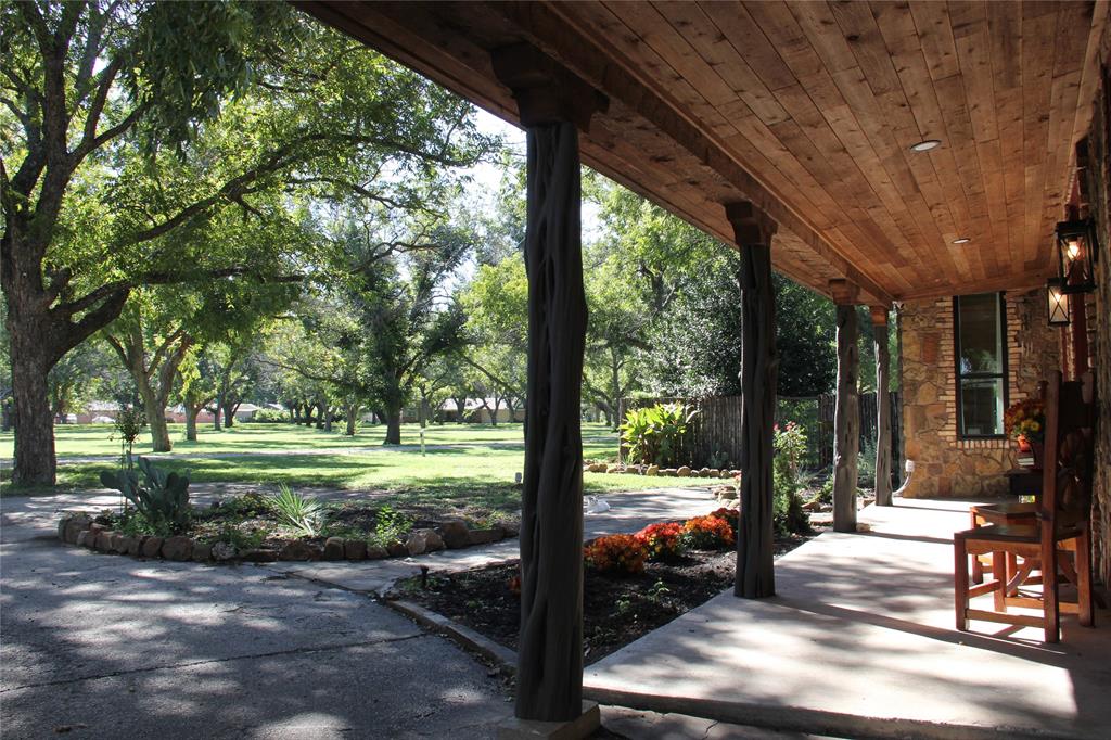 a view of yard with patio