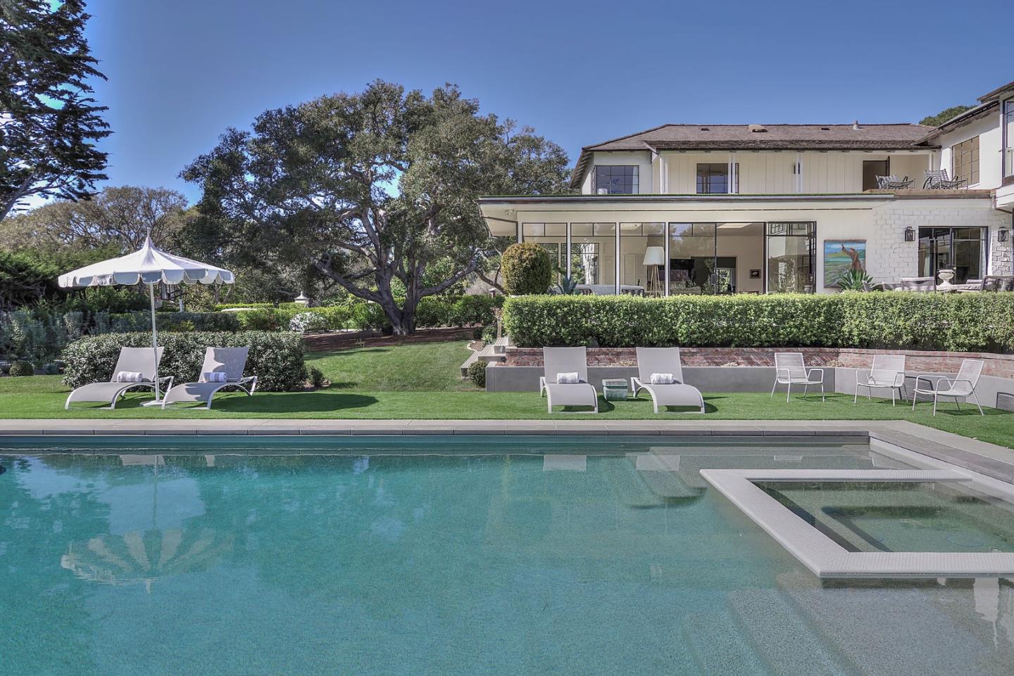 a front view of house with yard and outdoor seating