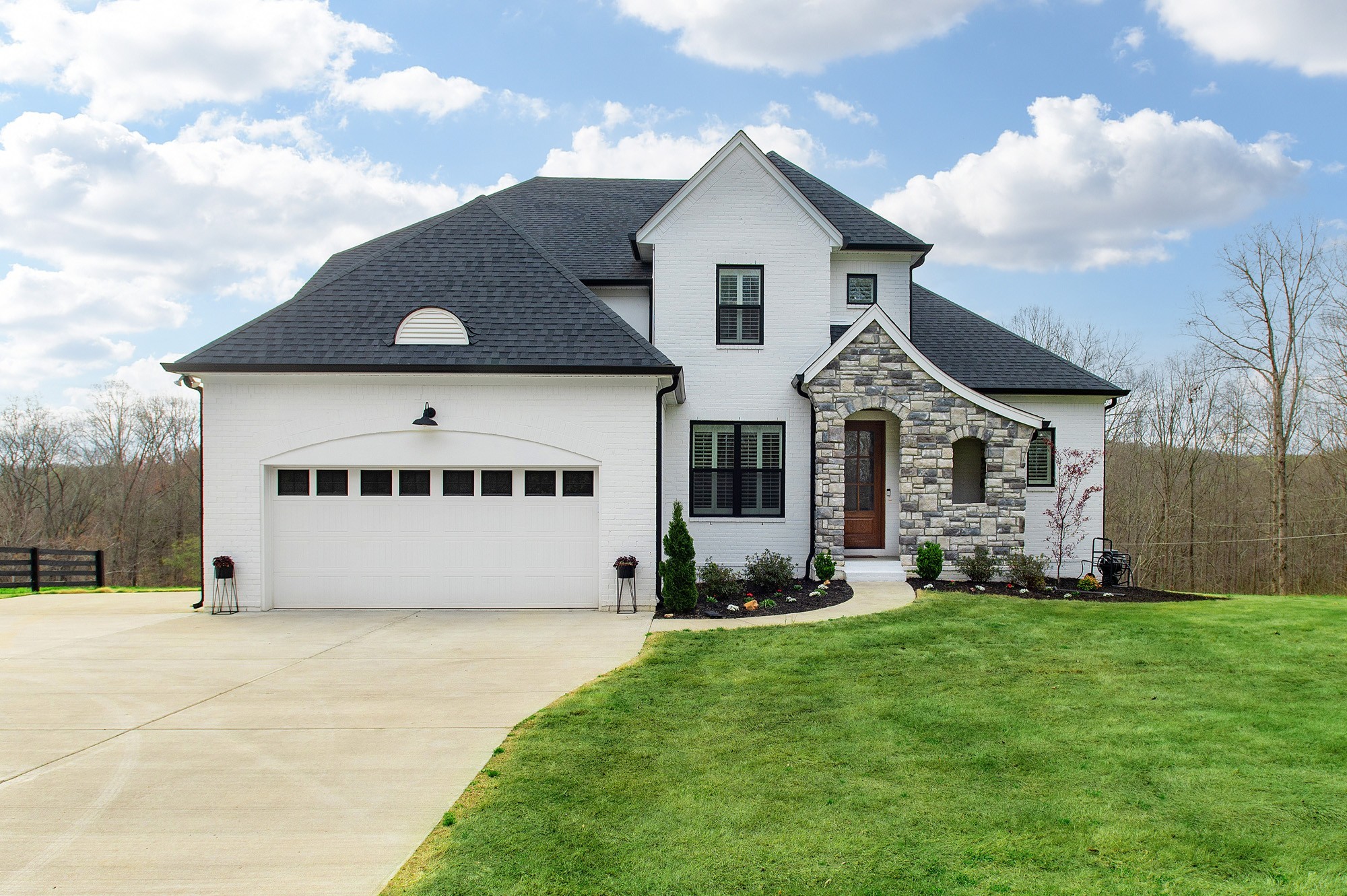 a view of house with yard and entertaining space