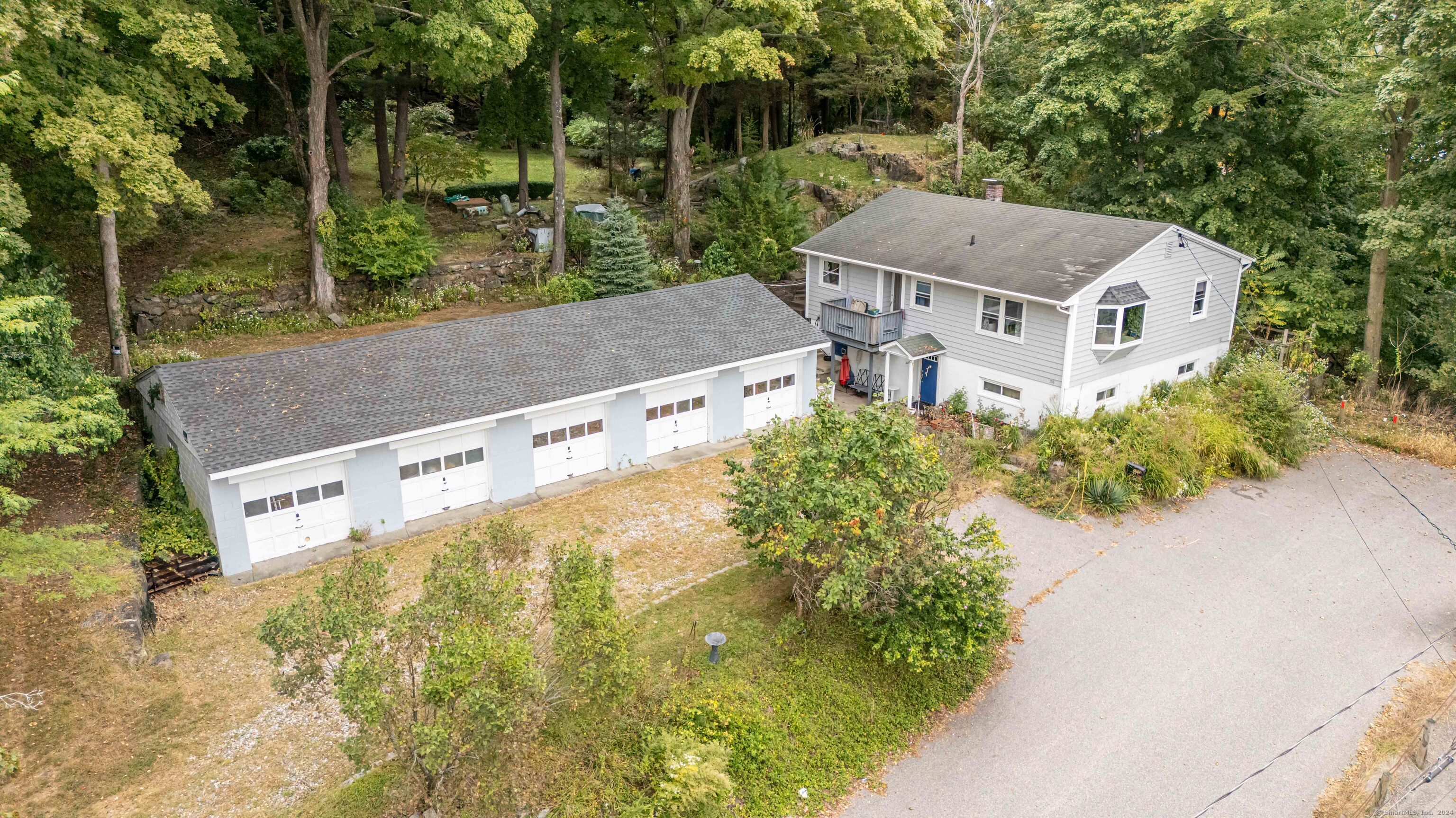 aerial view of a house with a yard