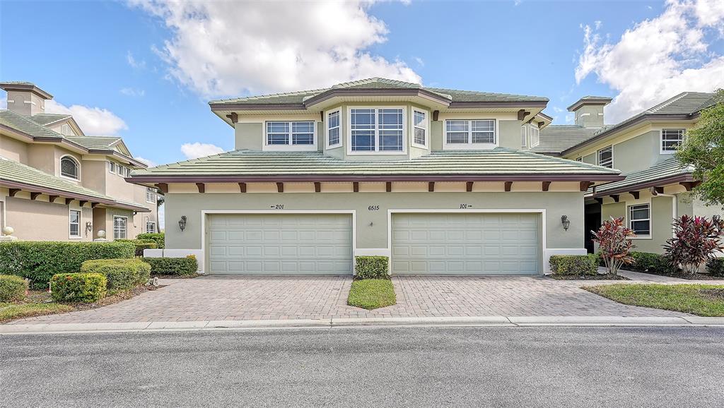 a front view of a house with a garage and a garage