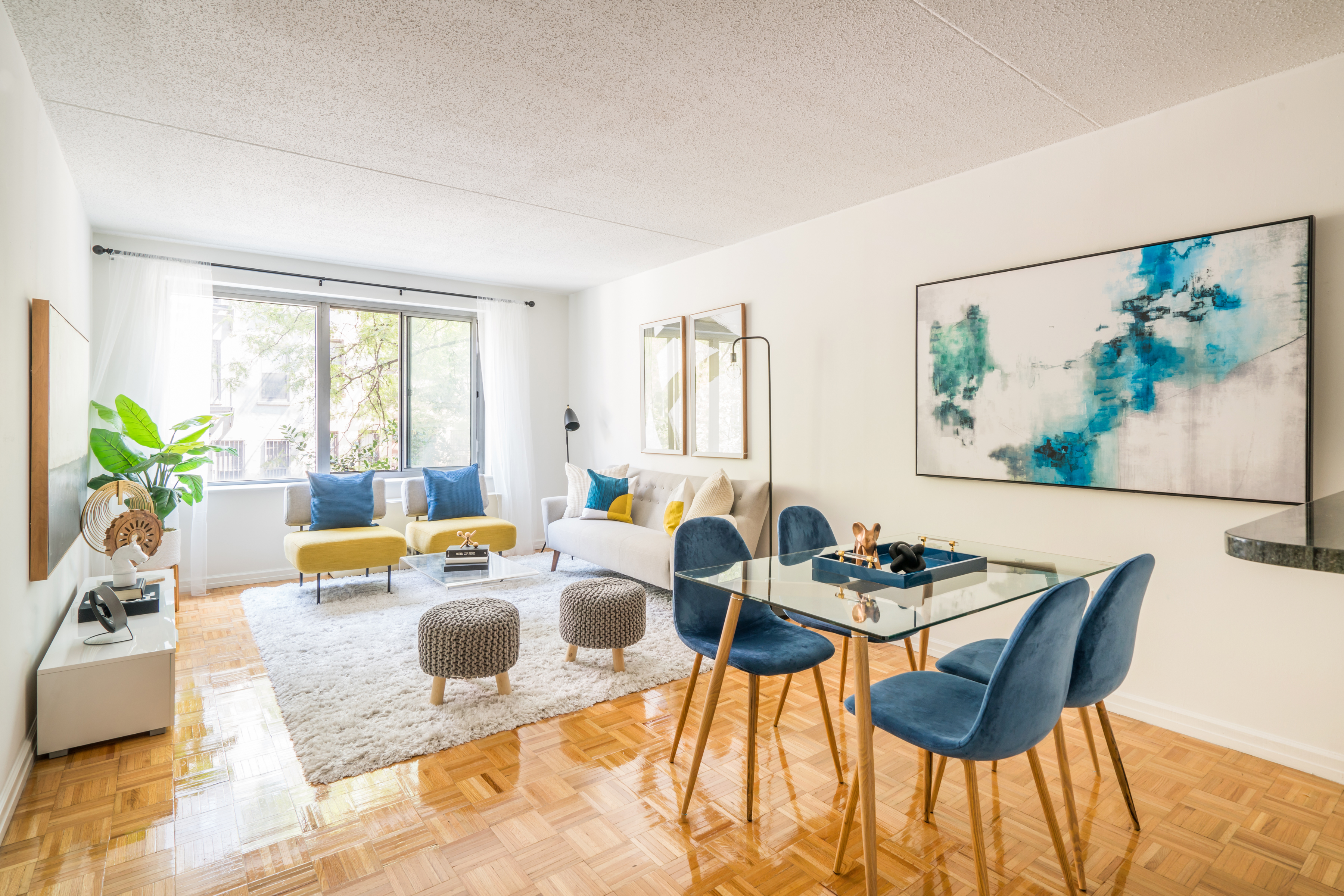 a dining room with furniture and wooden floor