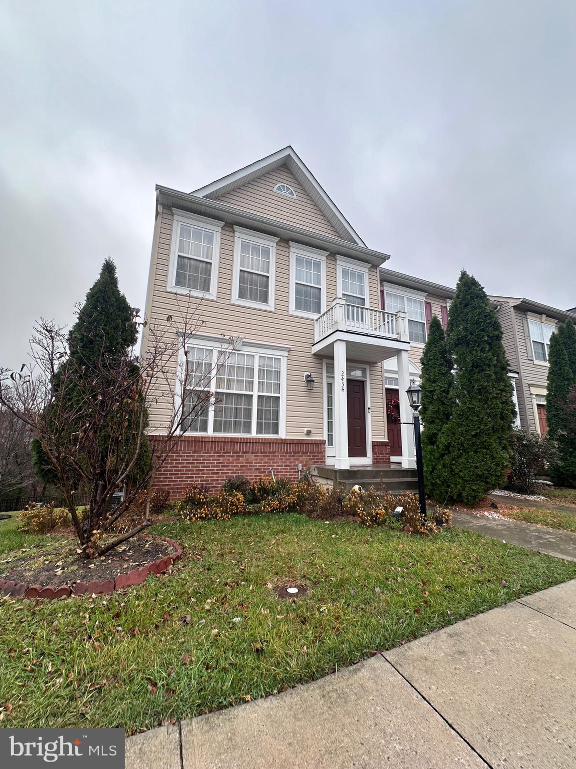 front view of a house with a yard