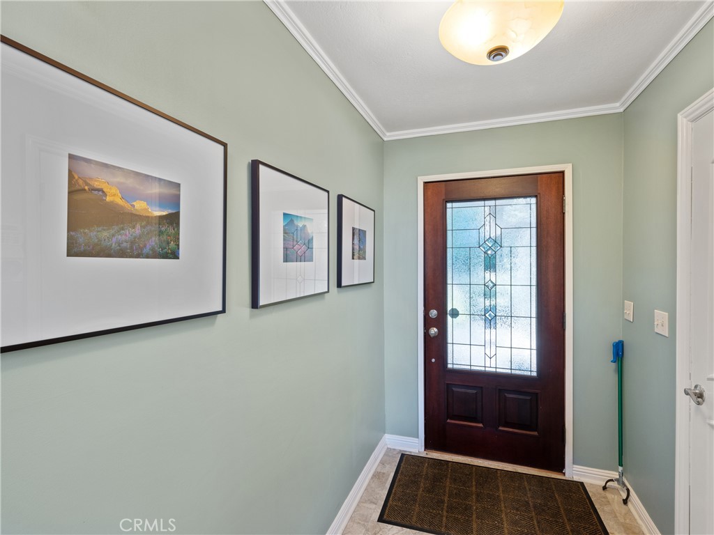 a view of front door with wooden floor