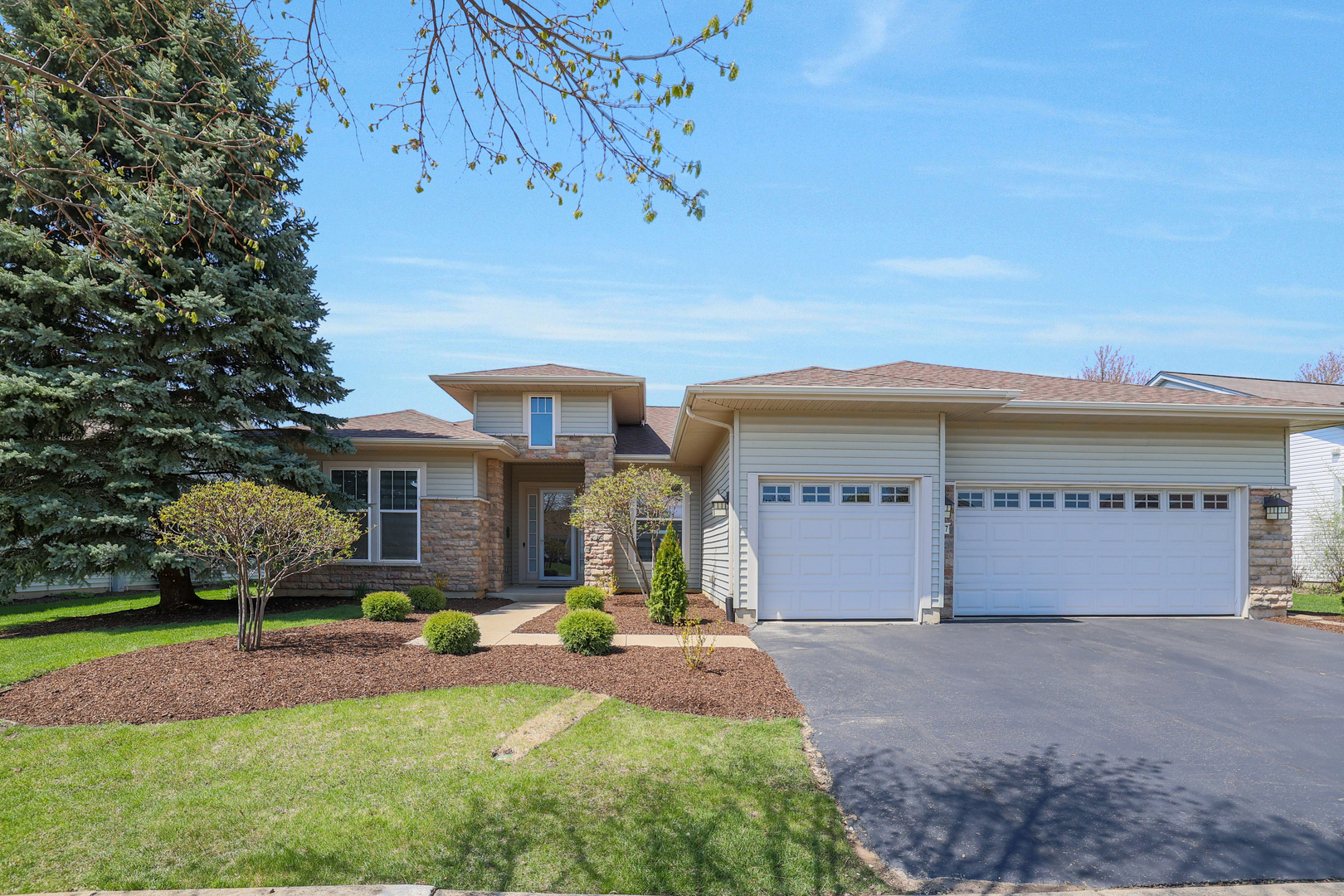 a front view of house with yard and outdoor seating