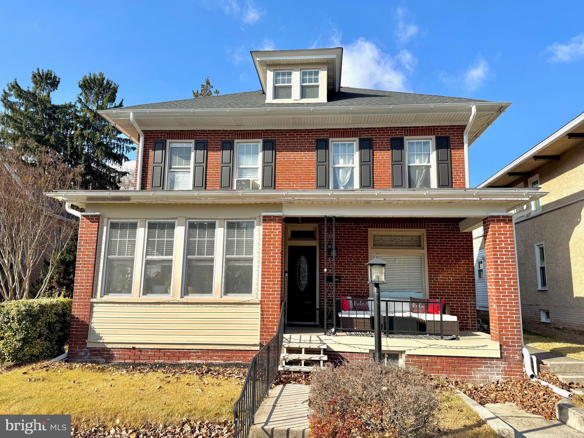 a front view of a house with a porch