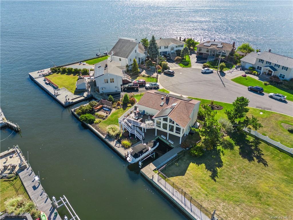 an aerial view of a house with a ocean view