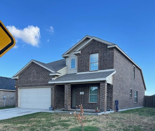 a front view of a house with garage