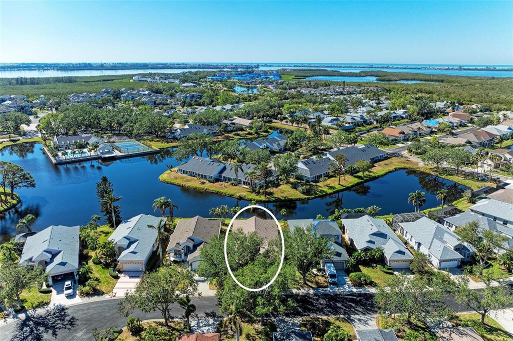 an aerial view of a house with a ocean view