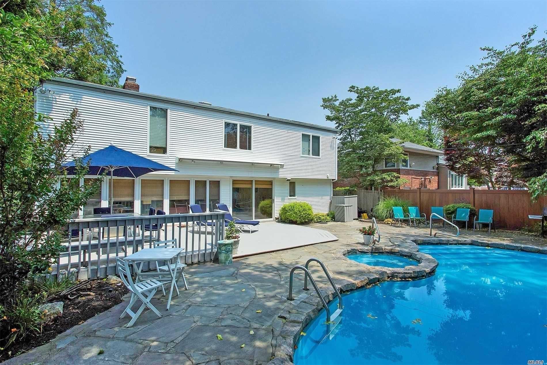 View of swimming pool featuring an in ground hot tub and a patio