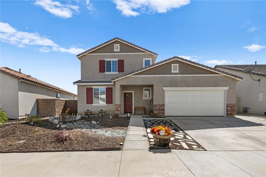 a front view of a house with garage