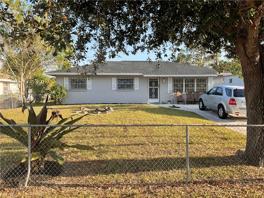 a house view with a sitting space and garden