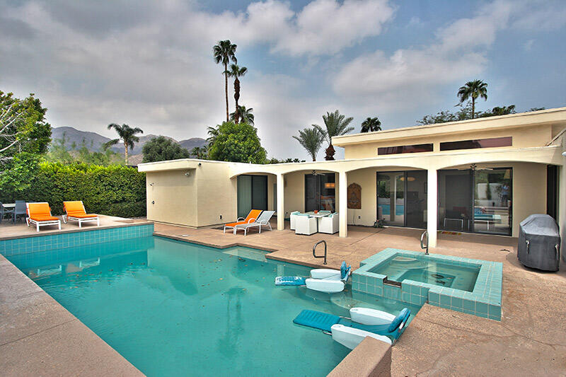 swimming pool with outdoor seating