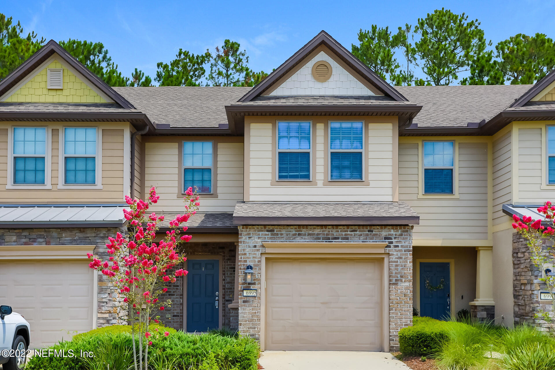 a front view of a house with a yard