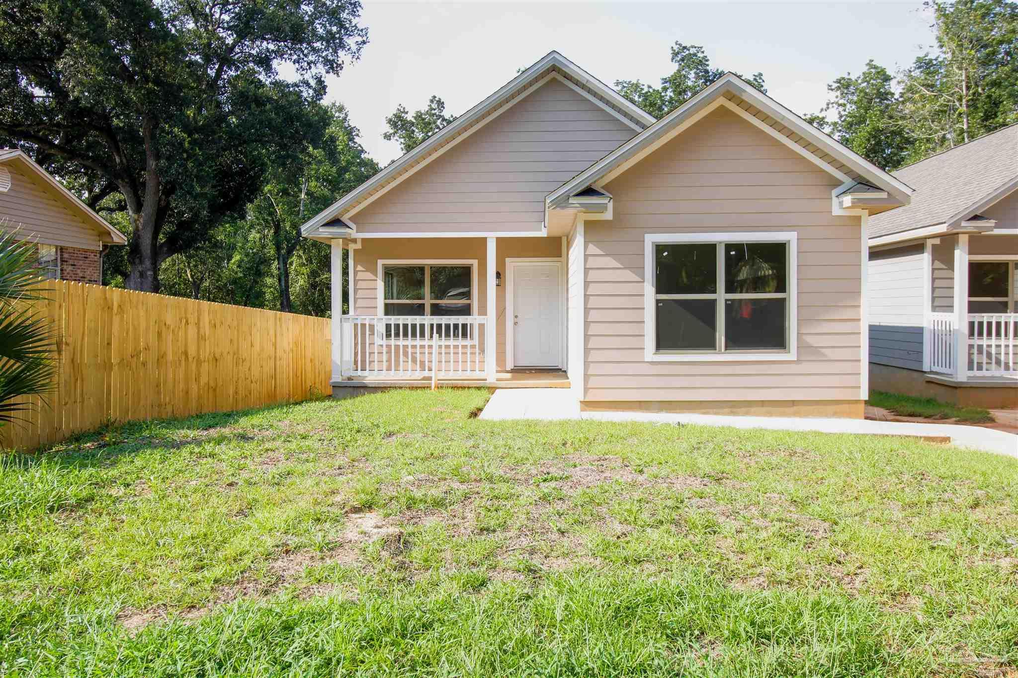 a house with garden in front of it