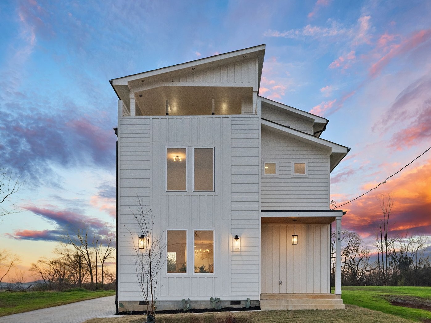 a front view of a house with a yard