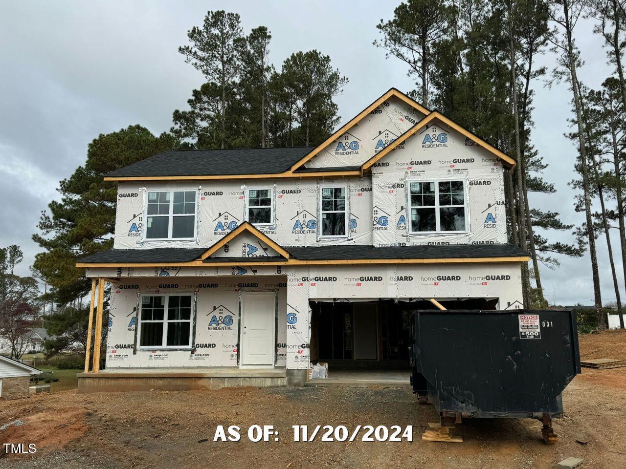 a front view of a house with a garage