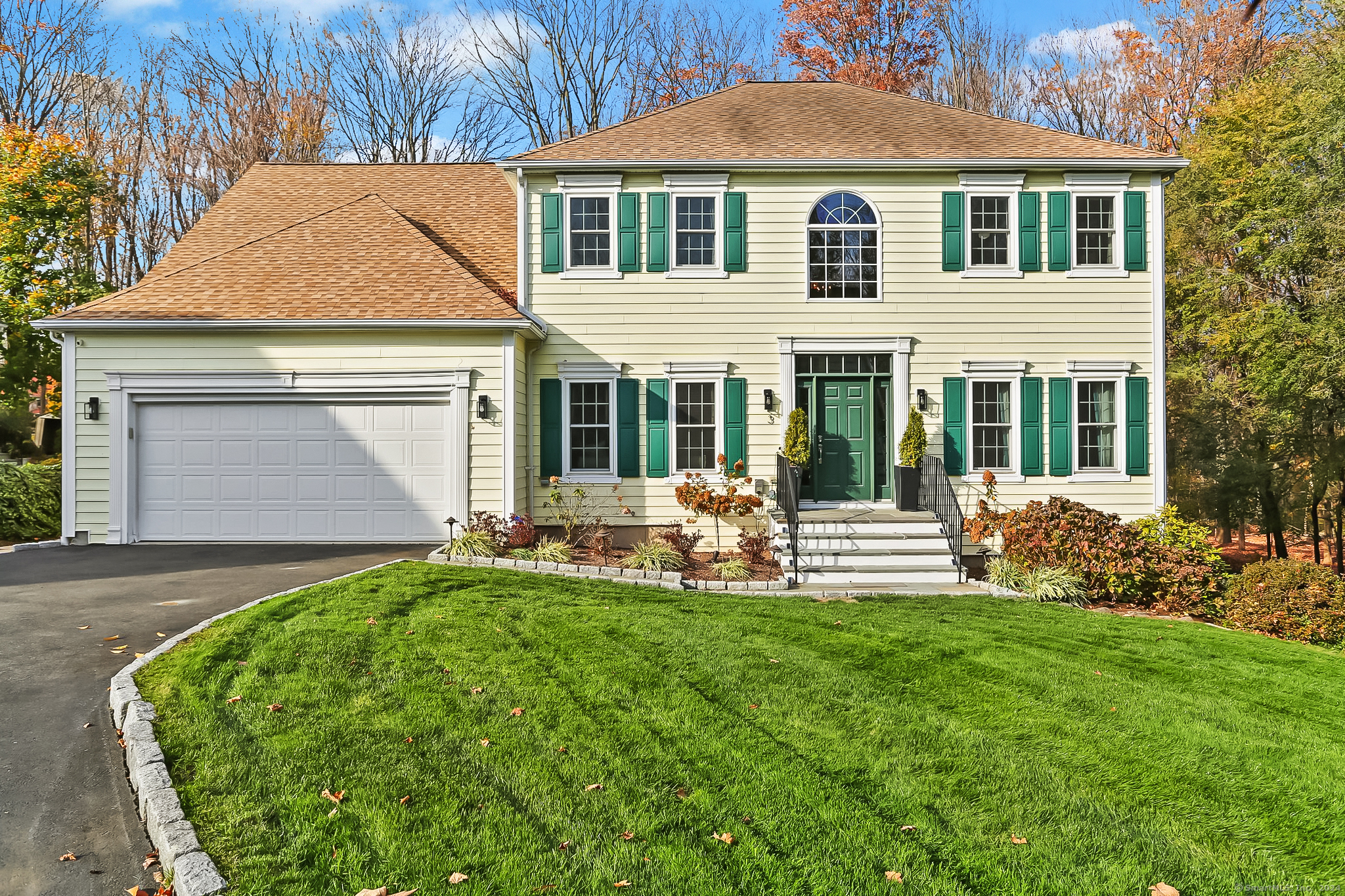 front view of a house with a yard