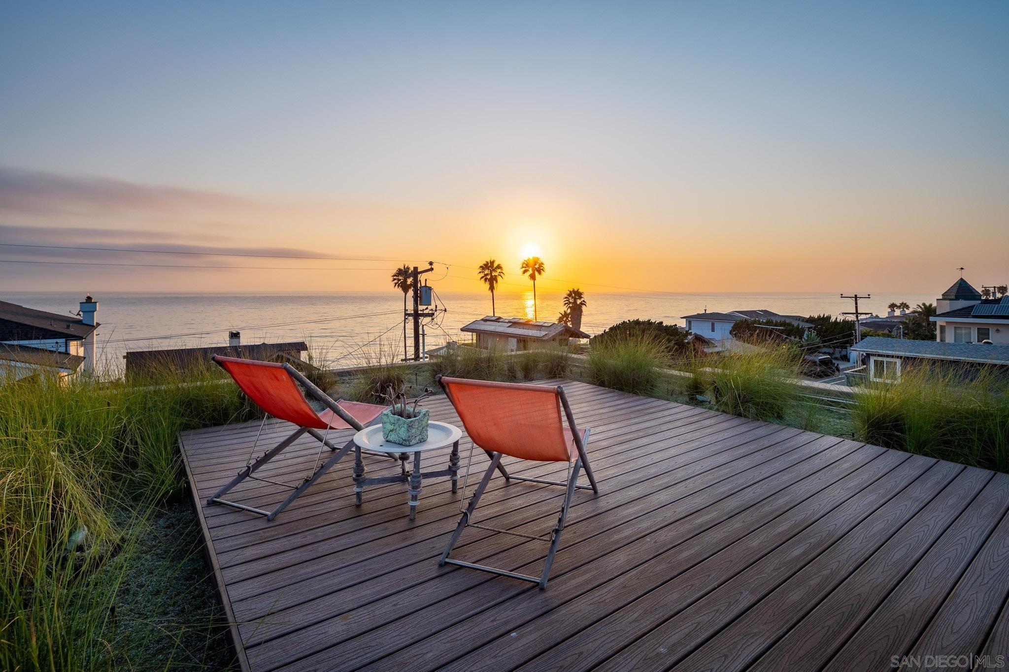 a wooden bench sitting on top of a wooden deck