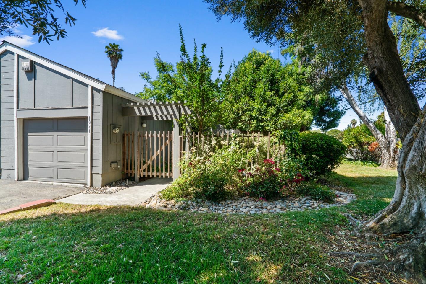 a view of a house with a small yard