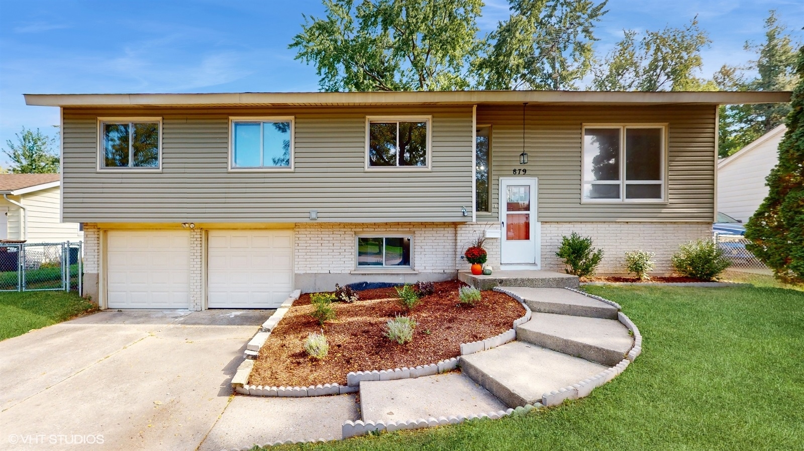 a front view of a house with garden