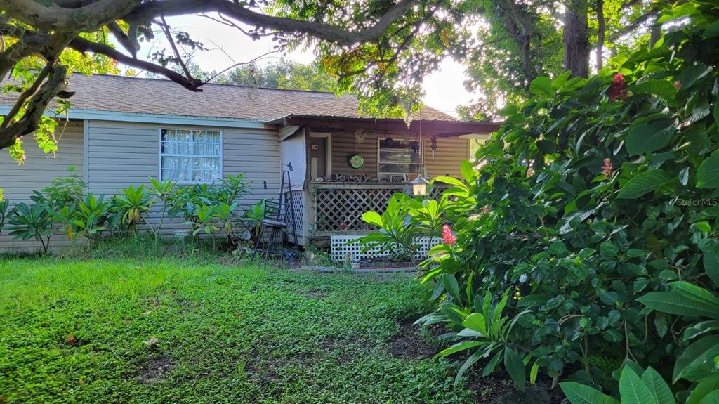 a backyard of a house with lots of green space