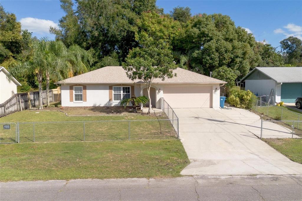 a house with trees in the background