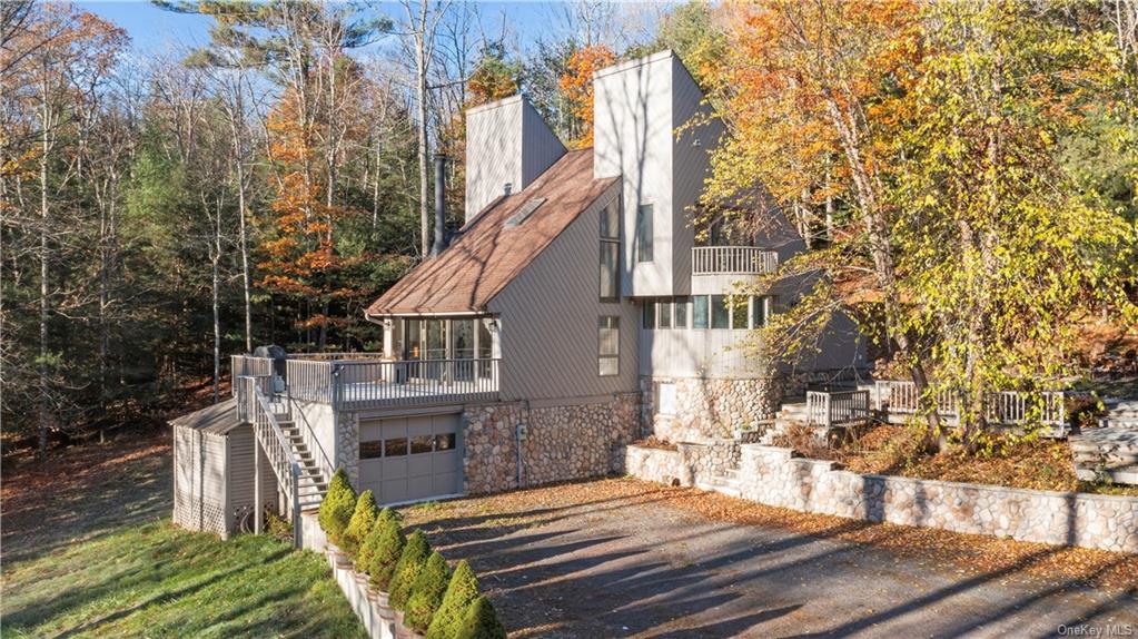 a view of a house with wooden fence