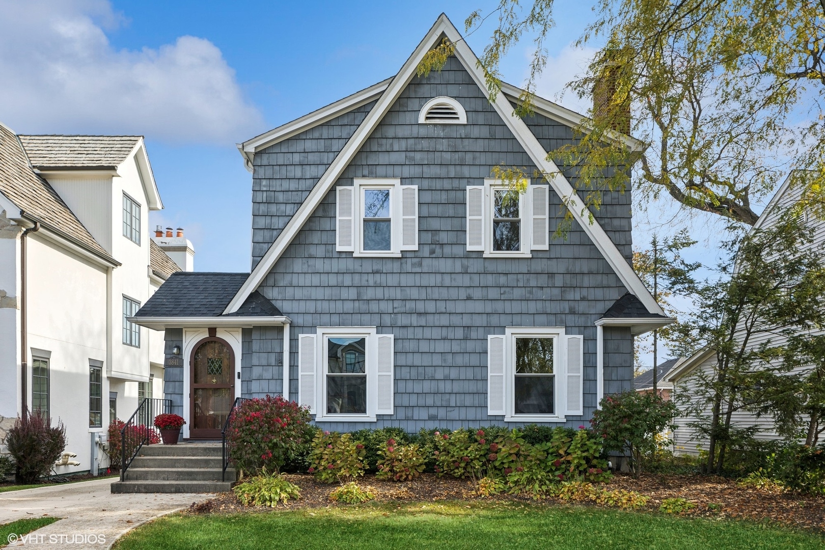 a front view of house with yard and green space