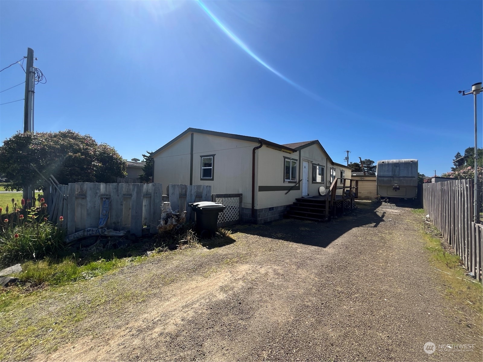 a view of a house in the middle of a yard