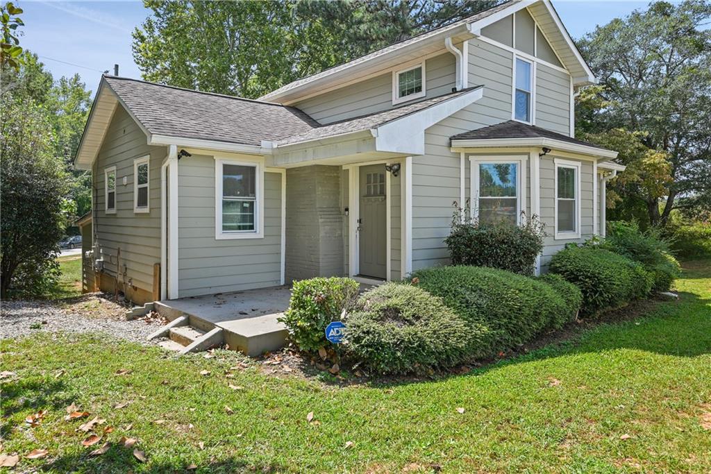 a front view of a house with a yard