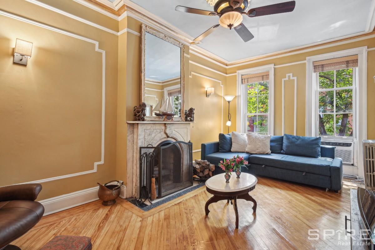 a living room with furniture and a fireplace