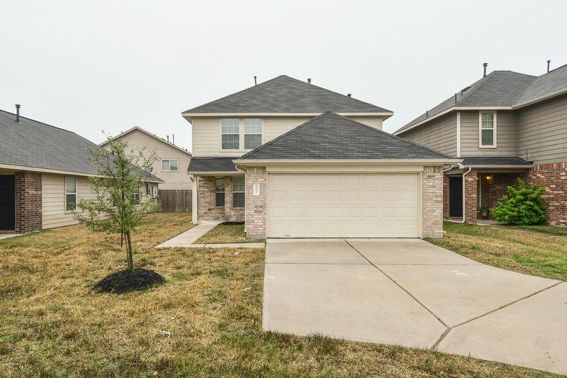 front view of a house with a yard