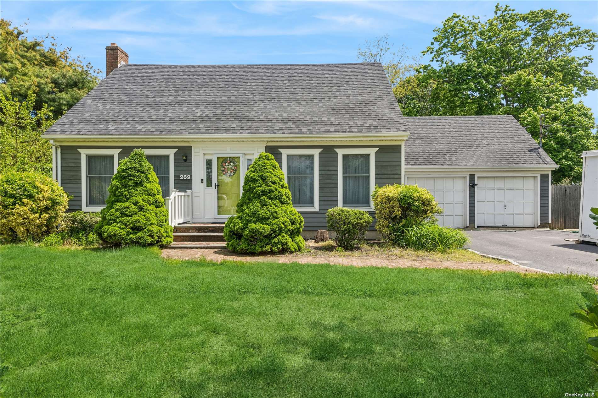 front view of a house with a yard