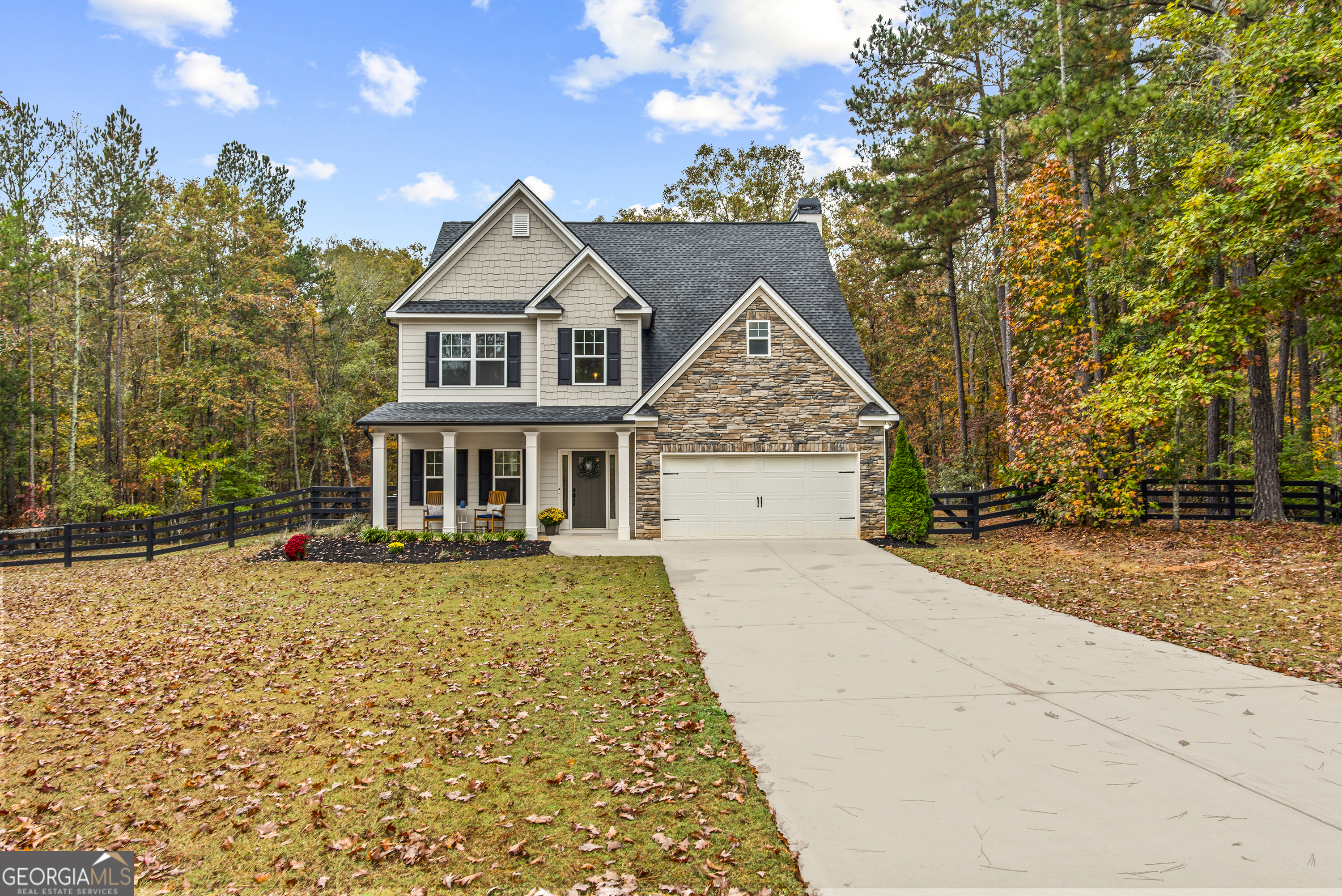 a front view of a house with yard