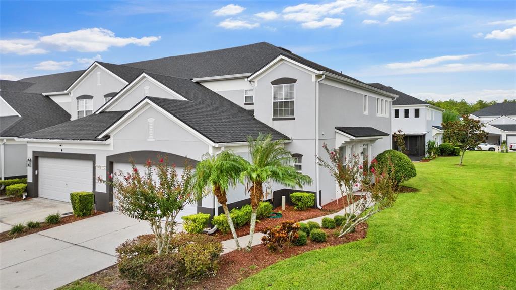 a front view of a house with a yard