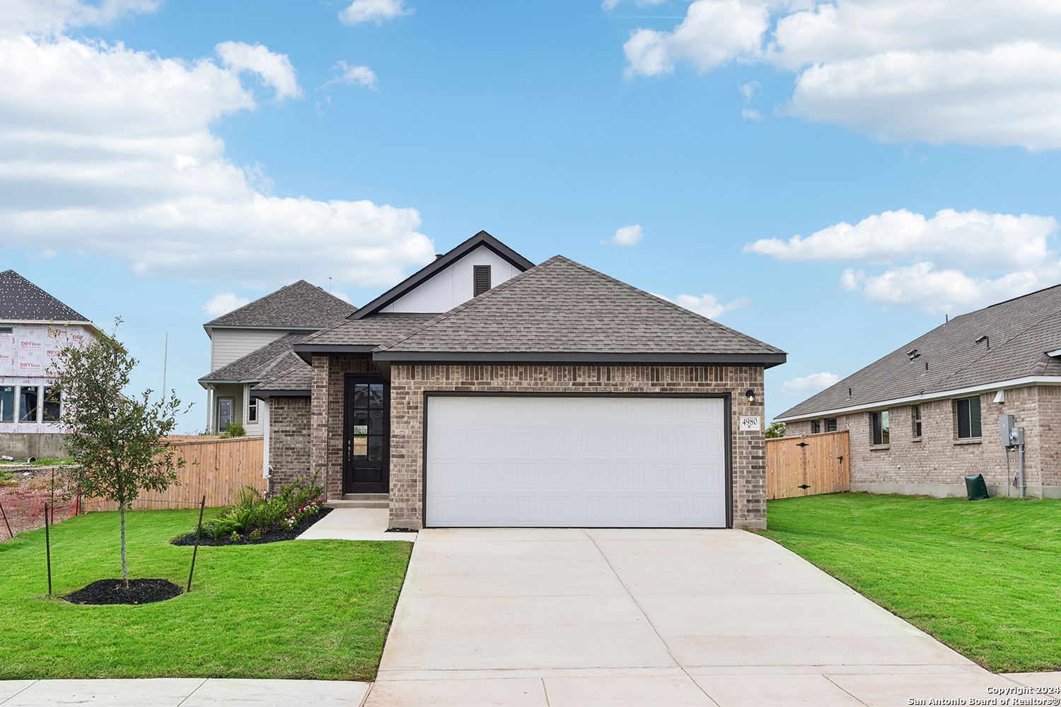 a front view of house with yard